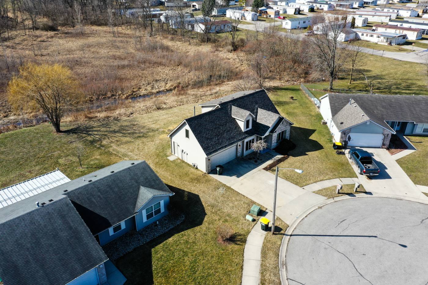Aerial drone photo of a home on a cul-de-sac purchased by Middle America Homes